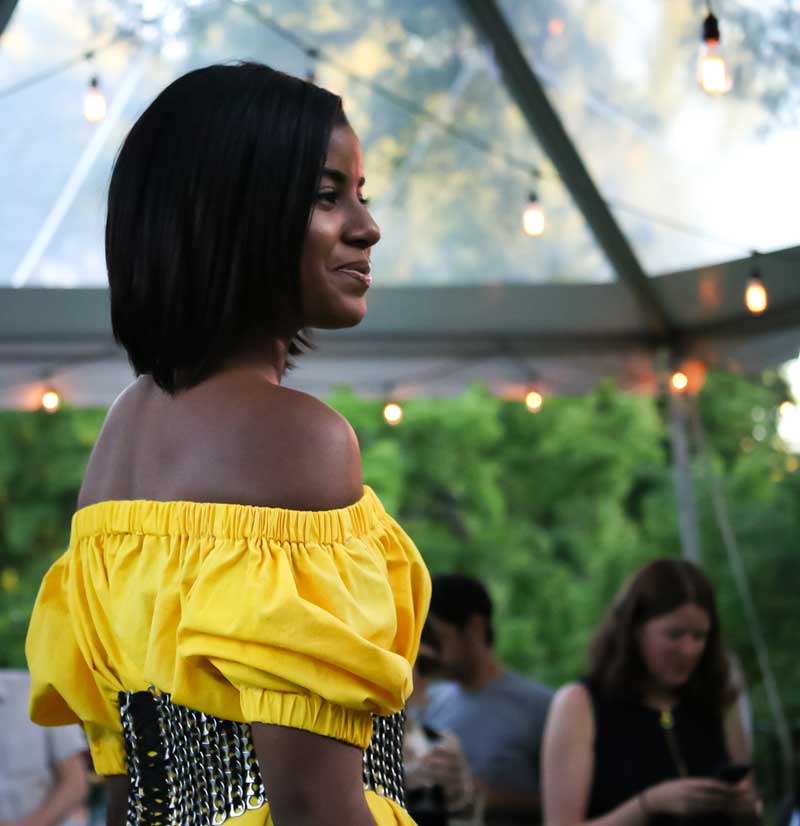 Naturally dyed yellow cotton dress with upcycled pull-tab belt at Style & Sustainability; a student-led sustainable fashion design competition.